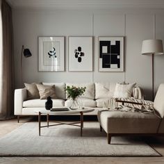 a living room filled with furniture and pictures on the wall above it's coffee table