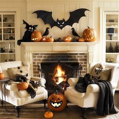 a living room decorated for halloween with pumpkins and bats