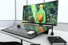 a computer monitor sitting on top of a desk next to a keyboard and mouse,