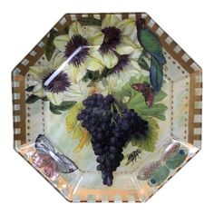 a glass plate with flowers and birds on it