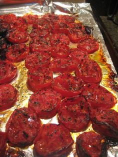 cooked tomatoes on tin foil ready to be baked