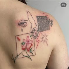 a woman's back with tattoos on her shoulder