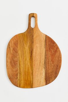 a wooden cutting board on a white background