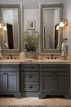 a bathroom with two sinks and mirrors on the wall next to each other in it