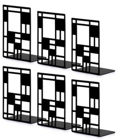 four black shelves with different shapes and sizes