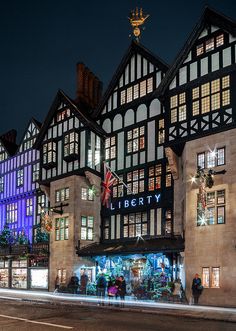 a large building with lots of windows and lights on it