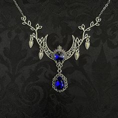 "This enchanting moon elf necklace features richly detailed antiqued silver tone filigree crescent, intricate leafy branches and elegant scroll drop accents. Its captivating design is adorned with dazzling dark sapphire blue glass crystals. Decorated portion is 4 1/2\" wide and 2 1/2\" tall in the very center.  Necklace length is adjustable with soldered stainless steel cable chain, lobster clasp and extender. If you would like a different length, please send us a message. Matching headpiece, pendant and earrings are listed separately in our store. If you don't see items with a color you want, feel free to ask about availability." Silver Bohemian Jewelry For Fantasy Events, Fantasy Jewelry Necklace, Dark Blue Earrings, Dark Sapphire, Filigree Necklaces, Choker Pendant, Jeweled Earrings, Magical Jewelry, Fancy Jewelry