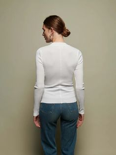 The perfect white, mock neck in our responsible Organic Rib. Use it as a layering piece or wear on it's own. Classic White Ribbed Turtleneck, White Ribbed Fitted Turtleneck, White Ribbed Long Sleeve Turtleneck, Elegant White Top With Ribbed Collar, Elegant White Tops With Ribbed Collar, Classic Turtleneck Top In Winter White, White Ribbed Turtleneck For Layering, Classic Winter White Turtleneck Top, Stretch Ribbed White Turtleneck