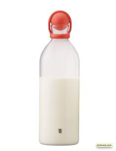 a glass bottle with a red lid and a white base is sitting on a white surface