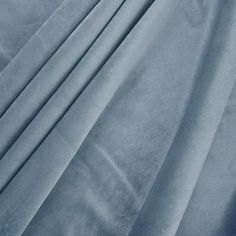 a close up view of a blue velvet fabric