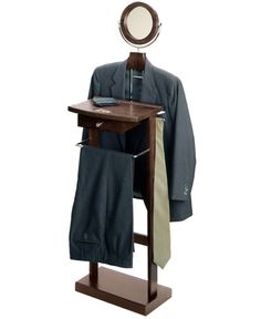 a suit and tie on a stand with a mirror above it that is also attached to a coat rack