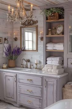 a bathroom with a chandelier hanging from the ceiling