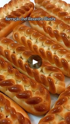 several braided breads are arranged on a white surface and ready to be eaten