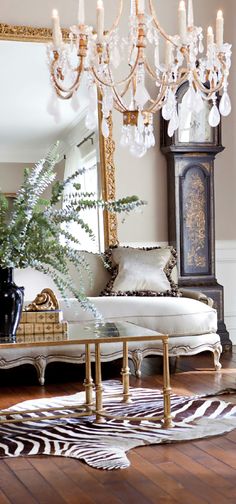 a living room filled with furniture and a tall clock