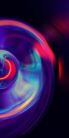 an abstract image of colorful circles in the dark