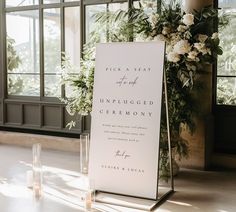 a sign that says pick a seat at an unplugged ceremony with candles