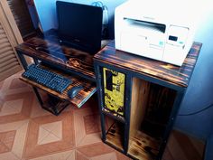 two computer desks with computers on top of them