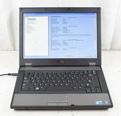 an open laptop computer sitting on top of a white table next to a mouse and keyboard