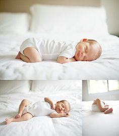 there is a baby sleeping on the bed