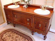 a bathroom with two sinks and a rug on the floor