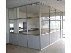 an empty office space with glass walls