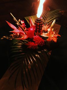 a candle that is on top of some flowers