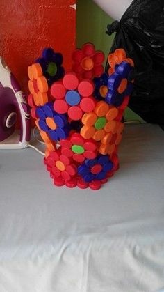 there is a vase made out of plastic beads