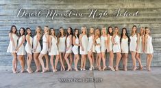 a group of women standing next to each other in white dresses with the words desert mountain high school written on them