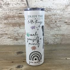 a white tumbler with the words enjoy the little things on it