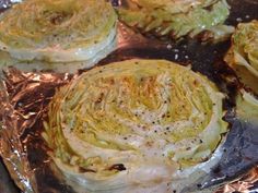 four pieces of cooked cabbage sitting on top of foil