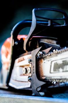 a close up of a chainsaw on top of a table