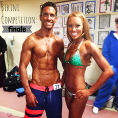 a man and woman standing next to each other in bikinis, posing for the camera