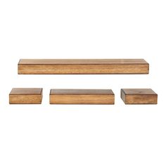 three pieces of wood sitting on top of each other