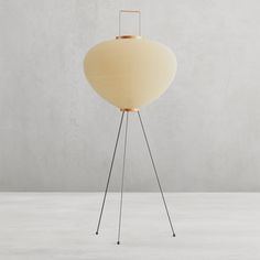 the floor lamp is made out of wood and metal