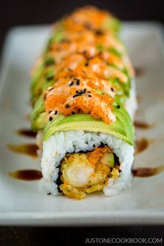 there is a sushi roll with avocado on it