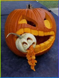 a jack o lantern pumpkin with an evil face carved into it's mouth and teeth