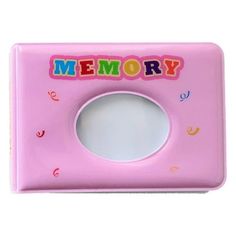 a pink toy camera with the words memory on it's front and back side