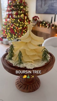 a christmas tree shaped cake sitting on top of a table