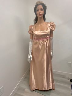 Stunning mocha brown satin gown with pink floral trim on the waist .this dress is made to order with the same material as pictured, THERE IS NO RETURNS OR EXCHANGES ACCEPTED PLEASE BE SURE TO CHECK THE MEASUREMENTS ON THE BOTTOM OF THE DESCRIPTION. If for any reason the measurements don't match with yours be sure to provide to me at the time of order. SMALL / BUST / Length 32-34. 45 MED / 36-38 / 46 LARGE /. 38-40/ 48 The small dress is made with a size 10 pattern , the medium with a size 12 and Gown Costume, Bridgerton Inspired, Brown Satin, Regency Era, Mocha Brown, Satin Gown, Costume Cosplay, Historical Dresses, Small Dress