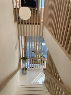 the stairs are made of wood and have white balconies