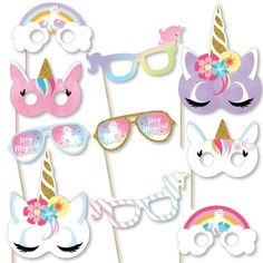 a group of unicorn masks and glasses on sticks