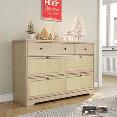 a wooden dresser with christmas decorations on top