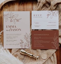 wedding stationery with flowers and leaves on it