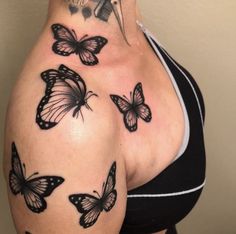 a woman's back with butterflies on her left side and the upper part of her stomach