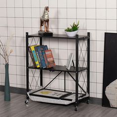 a shelf with books on it in front of a tiled wall and potted plant