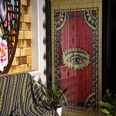 a living room with a couch and rugs on the floor