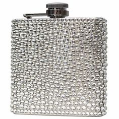 a silver metal flask with lots of beads on the front and side, in an elegant