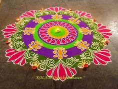 a colorful rangdi design on the ground for diwaling