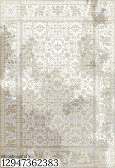 a beige and white rug with an ornate design