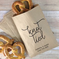 some pretzels and a bag that says knot tied